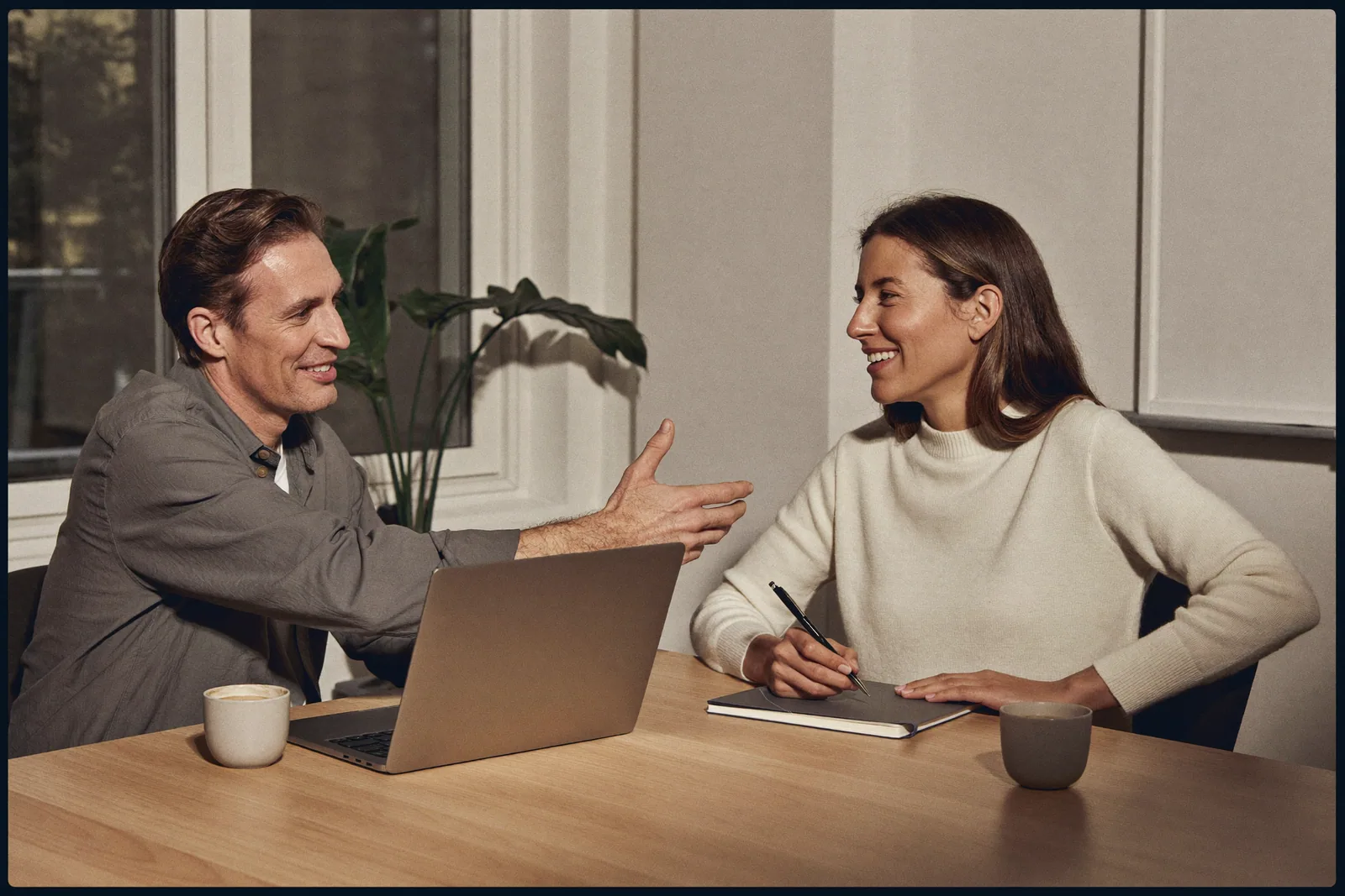 Two specialists working together at a table